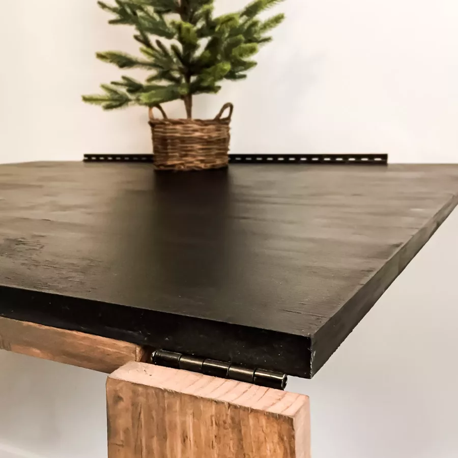 Corner leg of fold-out table with chalkboard top